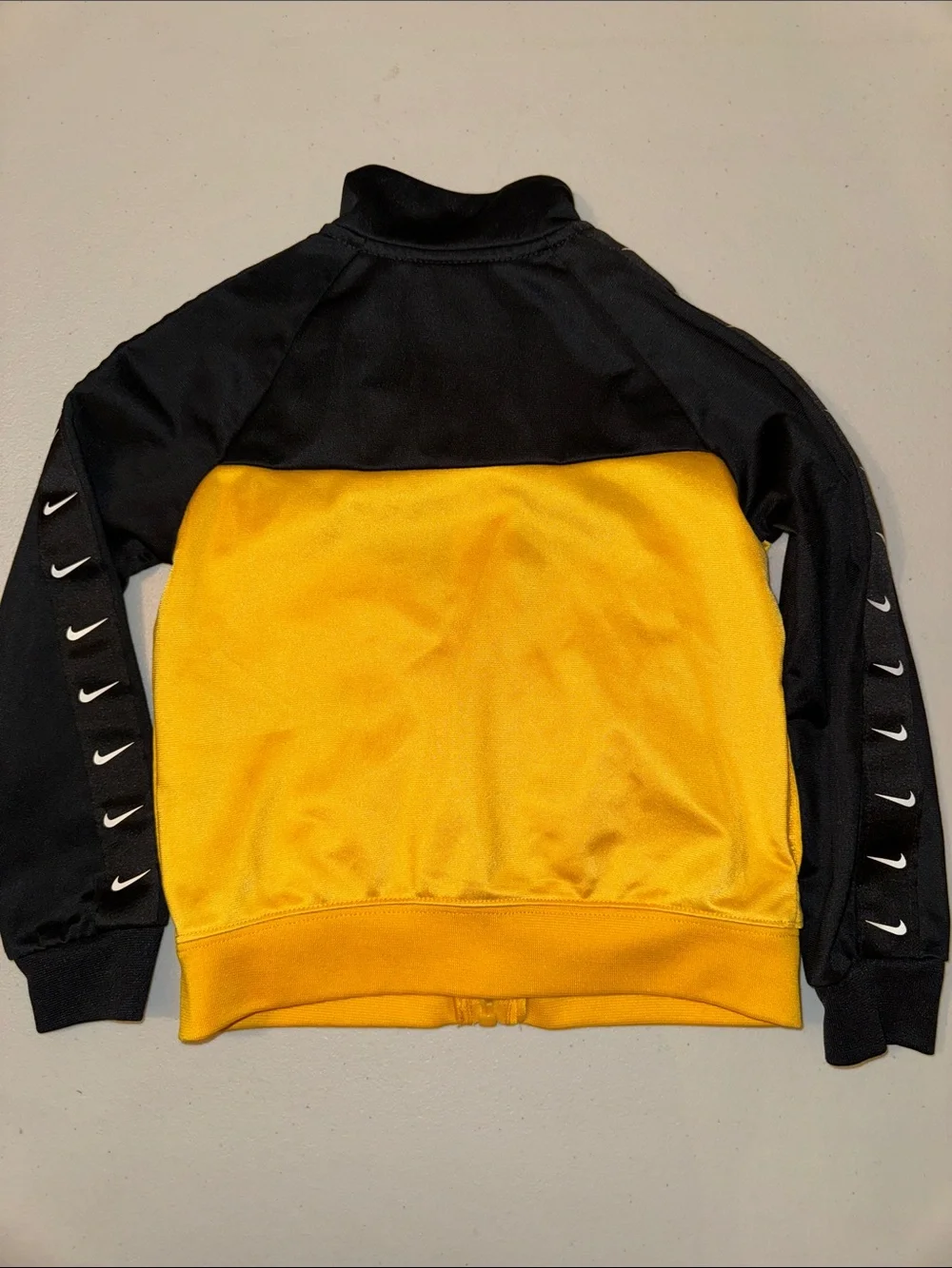 Nike Black and Gold Youth Zip-Up Track Jacket with Lion Runner Graphic
